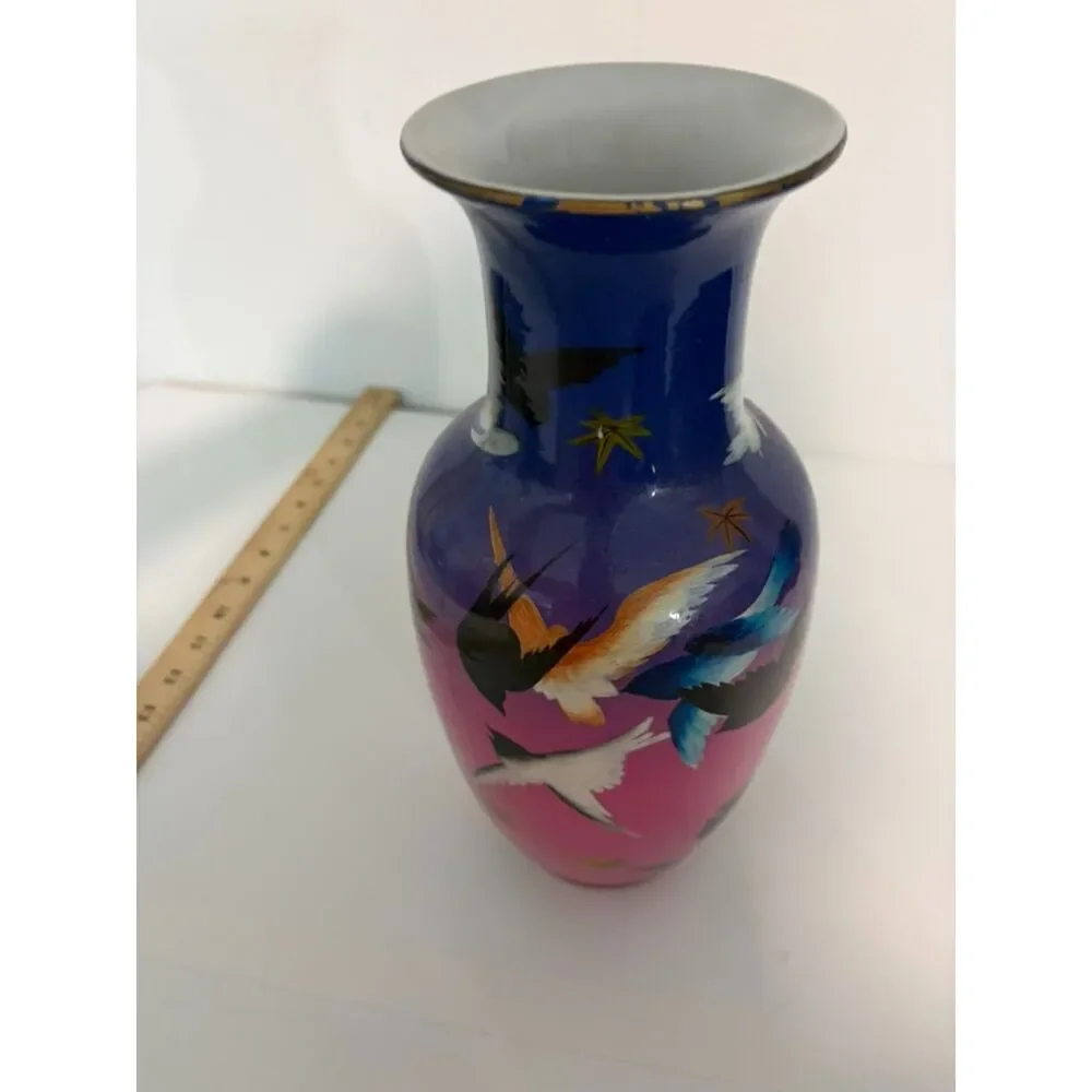 japanese vase with dark blue and pink ground, featuring birds